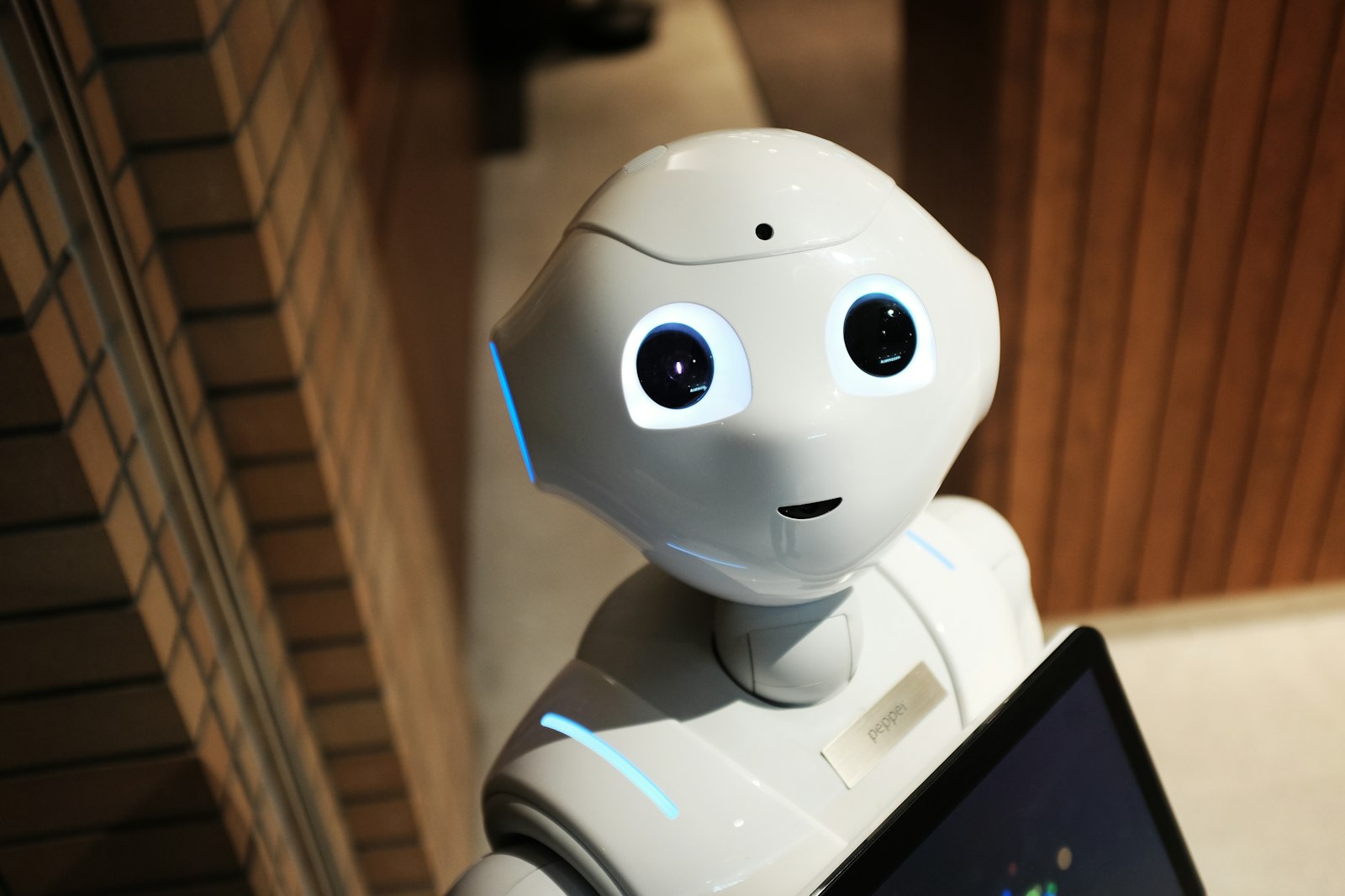 A white humanoid robot with glowing eyes